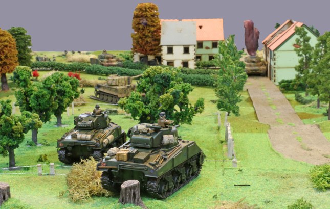 Shermans advancing on the village
